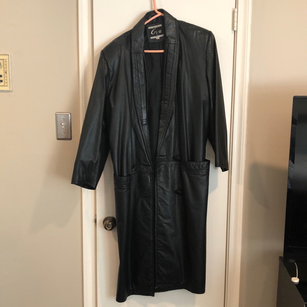 Long black 100% leather jacket. Button up below knee Matrix Style size medium.